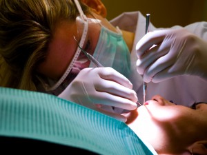 Dentist performing cleaning